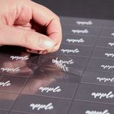 LABEL 2x1" PLASTIC CLEAR & WHT "APPLE" 100/cs