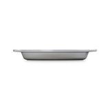 Signature Oval Baker 3qt 14x9 In. Enameled Cast Iron French Grey for even baking and oven-to-table presentation, Le Creuset 20188036541001